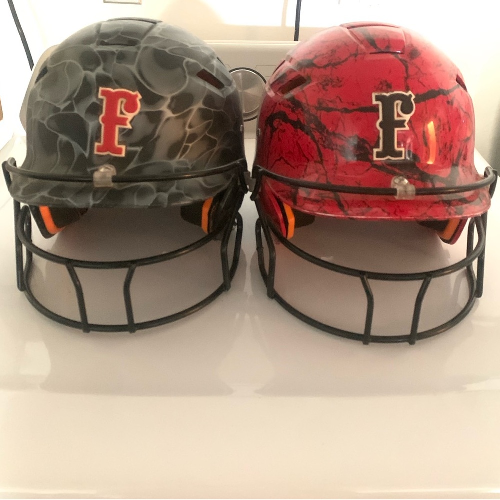 2 Firecrackers softball helmets worn one season